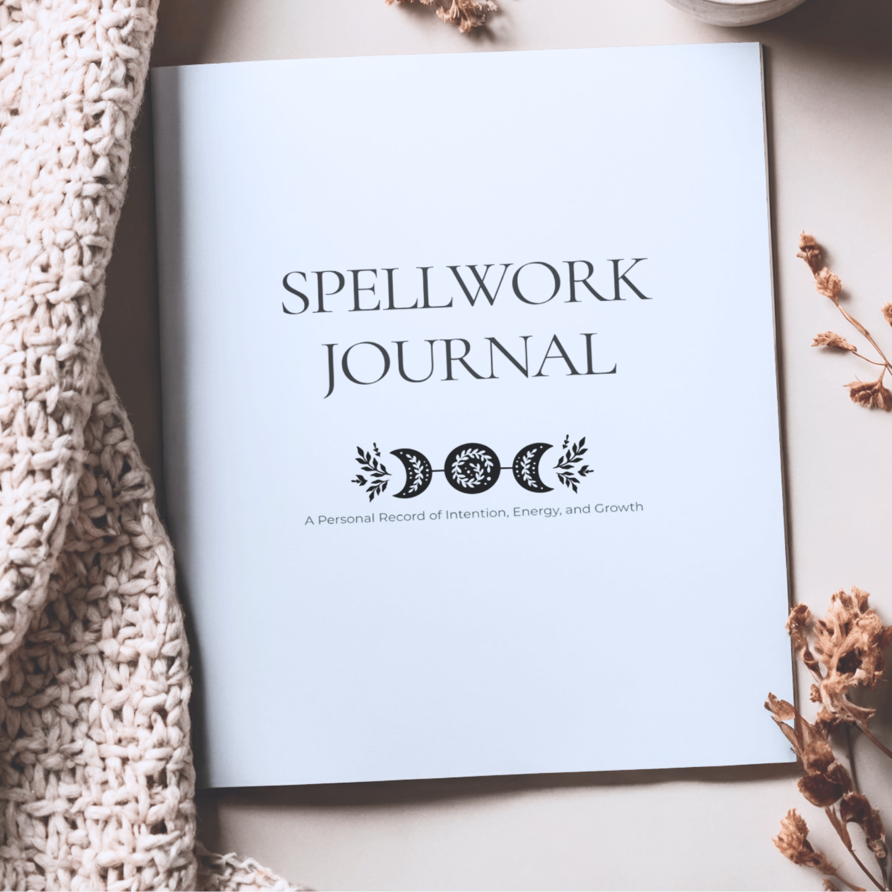 Spellwork Journal on a light surface with decorative elements