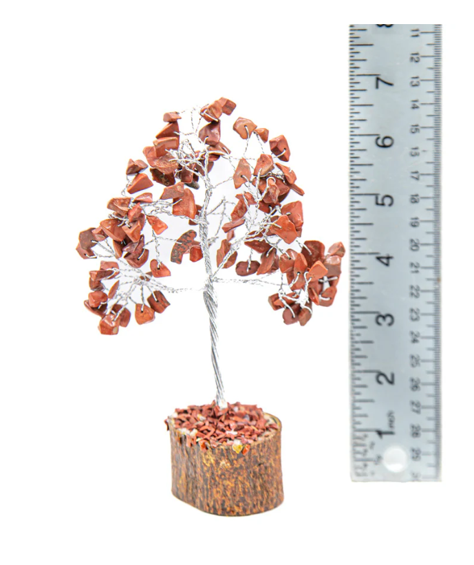 Decorative tree with red Jasper stones next to a ruler on a white background