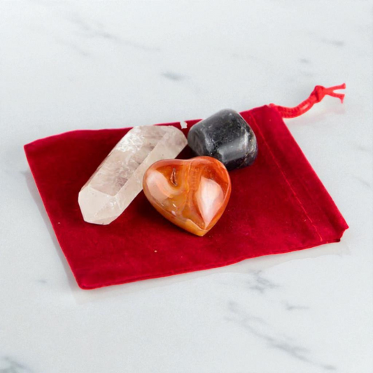 Aries Crystal Bundle featuring a mini Carnelian heart for motivation, tumbled Ruby for passion, and a Clear Quartz point